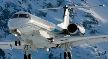 Private jet landing in the Alps